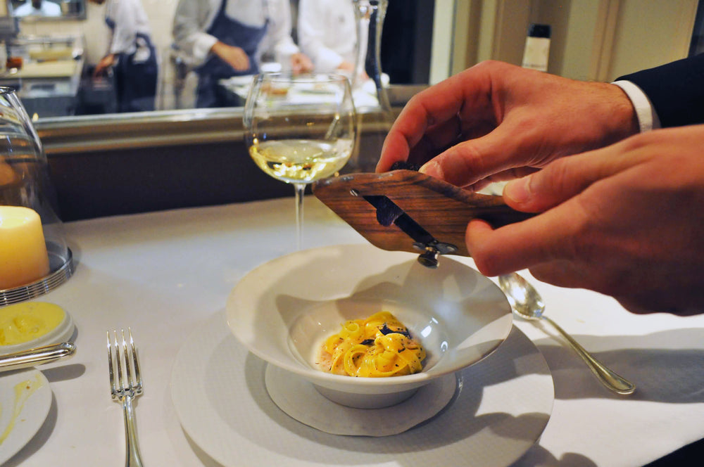 White truffles being shaved by Garrett Smith of Thatcher's Wine